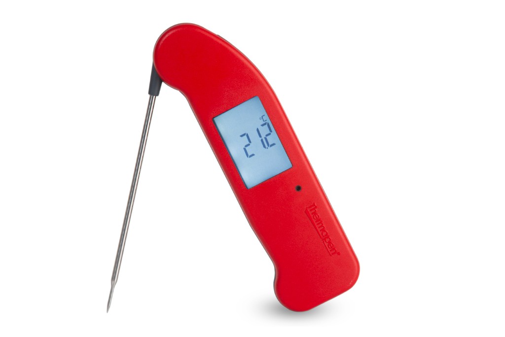 Red Thermapen One food thermometer standing upright, probe at a 45° angle, against a white background