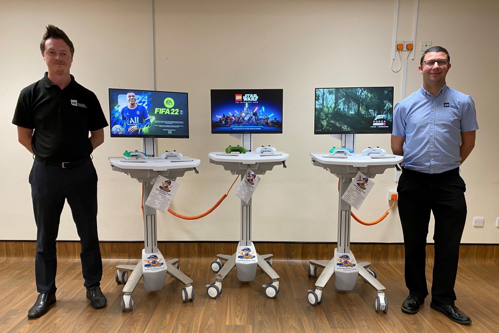 ETI staff members with the medical gaming carts donated to the Bluefin Children's Ward at Worthing Hospital