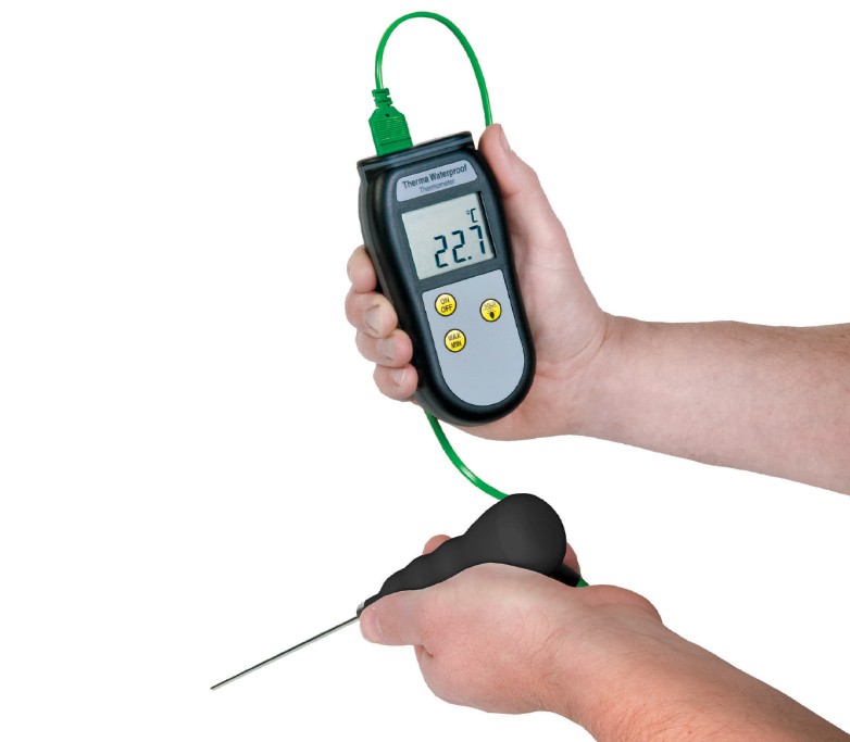 Hands holding a Therrma Waterproof thermometer